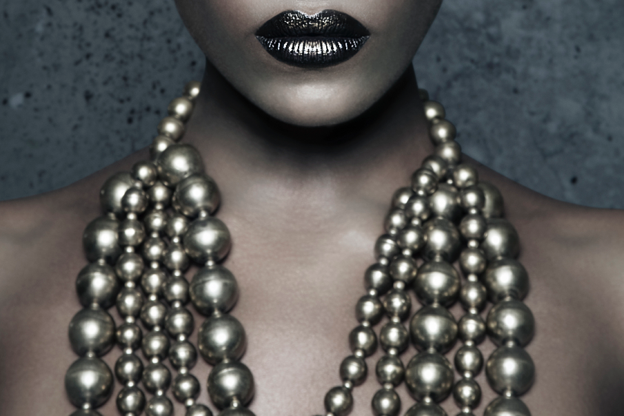 House of Nyabinghi_Afrofuturistic Black fashion model with ornate gold strand cascade neck jewellery